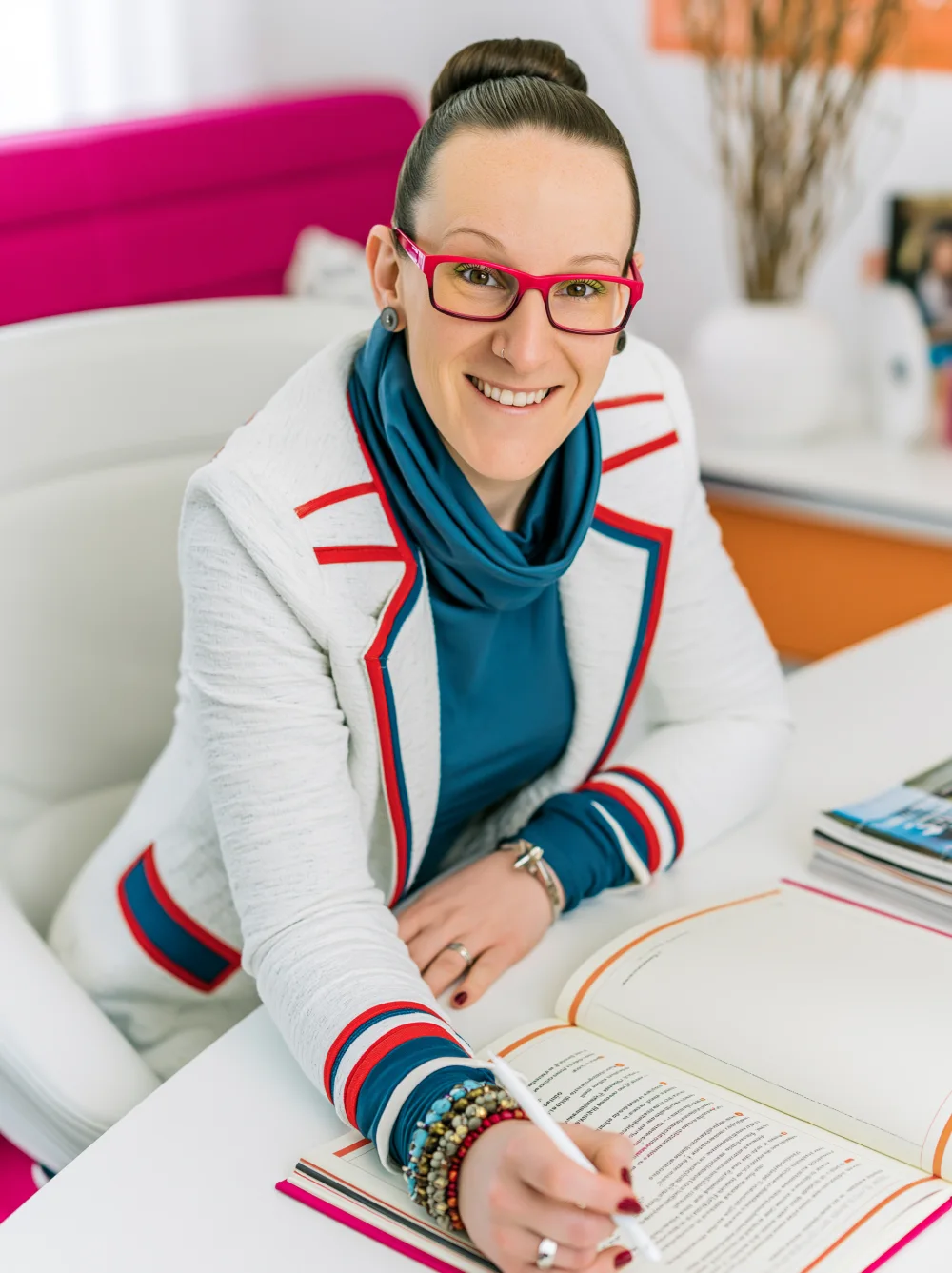 Emily Sharp, founder of EMMEDIA, at her desk